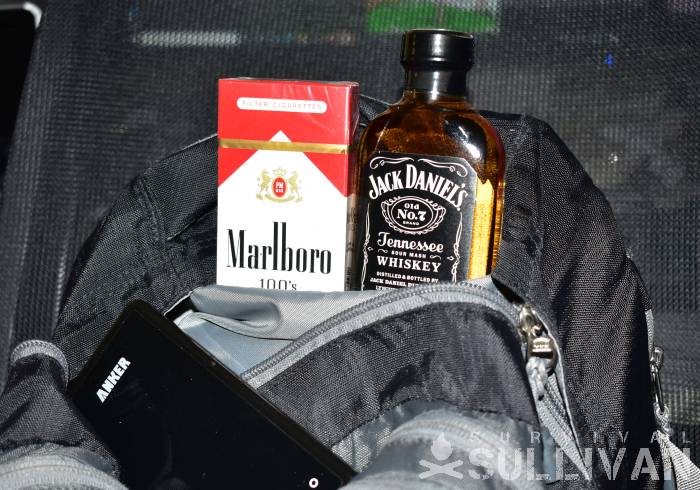 pack of Marlboro and bottle of Jack Daniels